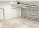 Spacious two car garage with block walls, white door, and garage door opener at 4683 Boston Ter, North Port, FL 34288