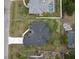 Birds eye view of this single Gathering residence featuring a paver driveway and manicured lawn at 1081 Mccrory St, North Port, FL 34286