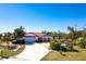 Beautiful single-story home with lush landscaping and a spacious driveway, a great curb appeal at 901 Don Juan Ct, Punta Gorda, FL 33950