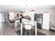 Well-appointed kitchen featuring a center island, modern appliances, and a cozy dining area at 901 Don Juan Ct, Punta Gorda, FL 33950