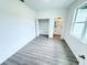 Bright and airy bedroom featuring wood-look floors, closet and modern design at 1294 Napoleon Rd, North Port, FL 34288