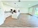 Open layout of kitchen and living room showing ample space, modern finishes and outdoor access at 1294 Napoleon Rd, North Port, FL 34288