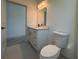 Simple bathroom with vanity, toilet and access to bedroom at 190 Redwood Rd, Rotonda West, FL 33947