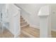 Modern staircase with light wood treads and white risers at 307 Shore Crab Way, Apollo Beach, FL 33572