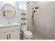 Clean bathroom with walk-in shower, white vanity, and hexagon tile floor at 307 Shore Crab Way, Apollo Beach, FL 33572