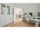 Bright home office features built-in shelving and wood-look floors at 307 Shore Crab Way, Apollo Beach, FL 33572