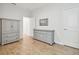 Spacious bedroom with grey dresser and wood flooring at 307 Shore Crab Way, Apollo Beach, FL 33572