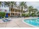 Resort-style pool with lounge chairs and palm trees at 307 Shore Crab Way, Apollo Beach, FL 33572