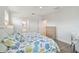 Main bedroom with king bed and access to bathroom and closet at 307 Shore Crab Way, Apollo Beach, FL 33572