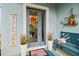 Front entrance with a gray door, welcome sign, and potted plants at 307 Shore Crab Way, Apollo Beach, FL 33572