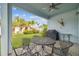 Covered patio with grill and outdoor seating at 307 Shore Crab Way, Apollo Beach, FL 33572