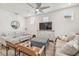 Comfortable living room with light grey sofa and ceiling fan at 307 Shore Crab Way, Apollo Beach, FL 33572