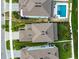 Aerial view of a home with a gray roof and landscaping at 307 Shore Crab Way, Apollo Beach, FL 33572
