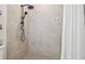 Modern walk-in shower with grey tile and black fixtures at 307 Shore Crab Way, Apollo Beach, FL 33572