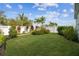 Landscaped backyard with lush tropical plants at 307 Shore Crab Way, Apollo Beach, FL 33572