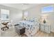 Main bedroom with a king-size bed and a sitting area at 307 Shore Crab Way, Apollo Beach, FL 33572