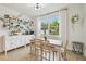 Bright dining area with wood table and white cabinets at 307 Shore Crab Way, Apollo Beach, FL 33572