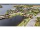 Community overview featuring lake, clubhouse, and landscaping at 307 Shore Crab Way, Apollo Beach, FL 33572