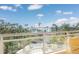 Stunning balcony view overlooking water, lush landscaping, and city skyline at 340 S Palm Ave # 11, Sarasota, FL 34236