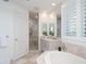 Elegant bathroom featuring a walk-in shower and soaking tub at 340 S Palm Ave # 11, Sarasota, FL 34236