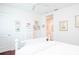 Spacious bedroom with a white dresser and hardwood floors at 340 S Palm Ave # 11, Sarasota, FL 34236