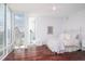 Elegant bedroom with hardwood floors and a white iron bed frame at 340 S Palm Ave # 11, Sarasota, FL 34236