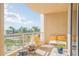 Outdoor balcony with seating area and partial water view at 340 S Palm Ave # 11, Sarasota, FL 34236
