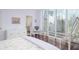Bedroom with large windows, hardwood floors and en-suite bathroom at 340 S Palm Ave # 11, Sarasota, FL 34236