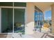 Spacious balcony with sliding doors and outdoor seating at 340 S Palm Ave # 11, Sarasota, FL 34236