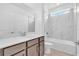 Modern bathroom with a vanity, ample counter space and a tiled shower-tub combo at 2626 Wise River Lane, Zephyrhills, FL 33539