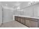 Modern bathroom featuring double sink vanity, oversized mirror, and glass enclosed shower with marble tile at 2626 Wise River Lane, Zephyrhills, FL 33539