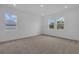 Spacious bedroom featuring carpet floors, recessed lighting, and lots of natural light at 2626 Wise River Lane, Zephyrhills, FL 33539