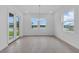 Bright dining room featuring tile floors, a chandelier, and scenic views at 2626 Wise River Lane, Zephyrhills, FL 33539