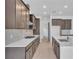 Gourmet kitchen featuring custom cabinets, stainless steel appliances, and an eat-in island at 2626 Wise River Lane, Zephyrhills, FL 33539