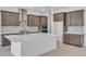 Gourmet kitchen featuring a large island, stainless steel appliances, and custom cabinets at 2626 Wise River Lane, Zephyrhills, FL 33539