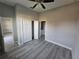 Bedroom with double door closet and grey vinyl flooring at 22139 Lockport Ave, Port Charlotte, FL 33952