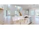 Open concept kitchen with island, stainless steel appliances, and hardwood floors at 3611 Lajuana Blvd, Wesley Chapel, FL 33543