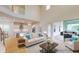 Spacious living area with hardwood floors, and access to covered patio at 3611 Lajuana Blvd, Wesley Chapel, FL 33543