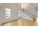 Spacious living room with hardwood floors and staircase at 3611 Lajuana Blvd, Wesley Chapel, FL 33543