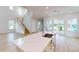 Open concept kitchen with island, stainless steel appliances, and hardwood floors at 3611 Lajuana Blvd, Wesley Chapel, FL 33543