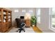 Home office with built-in shelves and large windows at 3611 Lajuana Blvd, Wesley Chapel, FL 33543