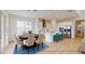 Bright kitchen with island, stainless steel appliances, and white cabinets at 3611 Lajuana Blvd, Wesley Chapel, FL 33543