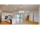Modern kitchen with white cabinets, island, and hardwood floors at 3611 Lajuana Blvd, Wesley Chapel, FL 33543
