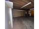 Attached garage with double door and overhead storage at 13619 Twin Lakes Ln # 15, Tampa, FL 33618