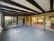 Spacious sunroom with wood beam ceiling, and multiple windows at 13619 Twin Lakes Ln # 15, Tampa, FL 33618