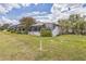 Backyard of a row of villas featuring a screened in porch at 13619 Twin Lakes Ln # 15, Tampa, FL 33618