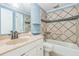 Bathroom featuring decorative tile in the shower, tile flooring, and neutral vanity at 13619 Twin Lakes Ln # 15, Tampa, FL 33618