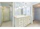 This bathroom offers a wide mirror and a neutral vanity, plus shower and closet access at 13619 Twin Lakes Ln # 15, Tampa, FL 33618
