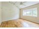 Empty bedroom featuring wood flooring and large windows providing plenty of natural light at 13619 Twin Lakes Ln # 15, Tampa, FL 33618