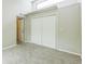 Bedroom with neutral carpeting, double closet and transom window at 13619 Twin Lakes Ln # 15, Tampa, FL 33618
